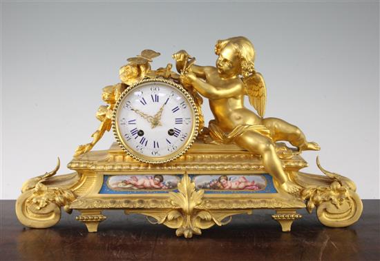 A 19th century French ormolu and Sevres style porcelain mantel clock, 17.5in.